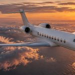 Flying Privately from the US to Portugal: How a Tailored Trip Comes Together Long-range private jet over the Atlantic at sunset