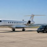 Vila Nova de Milfontes by Private Driver After Flying Privately to Portugal Illustrative long-range private jet and black Mercedes-Benz V-Class on an airport apron